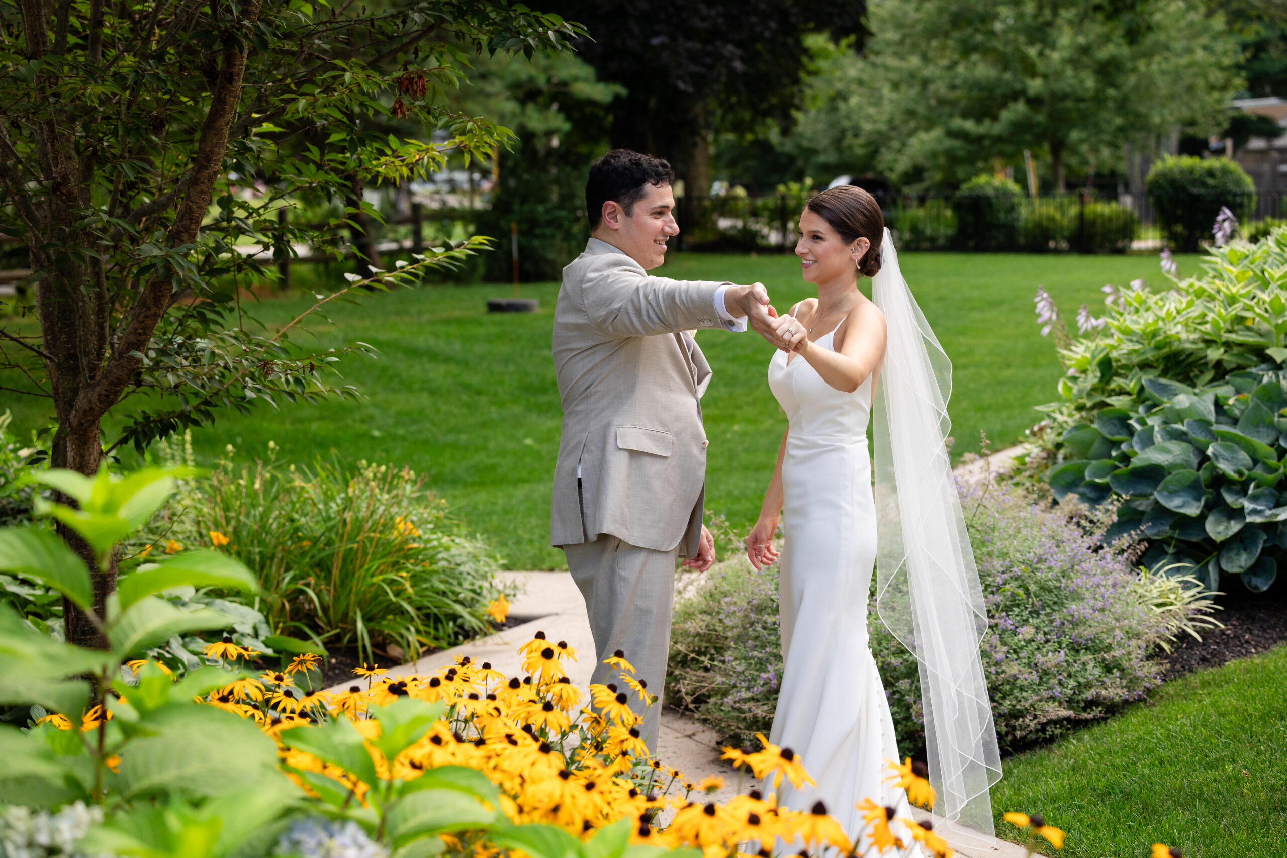 couple dances in yellow flowers